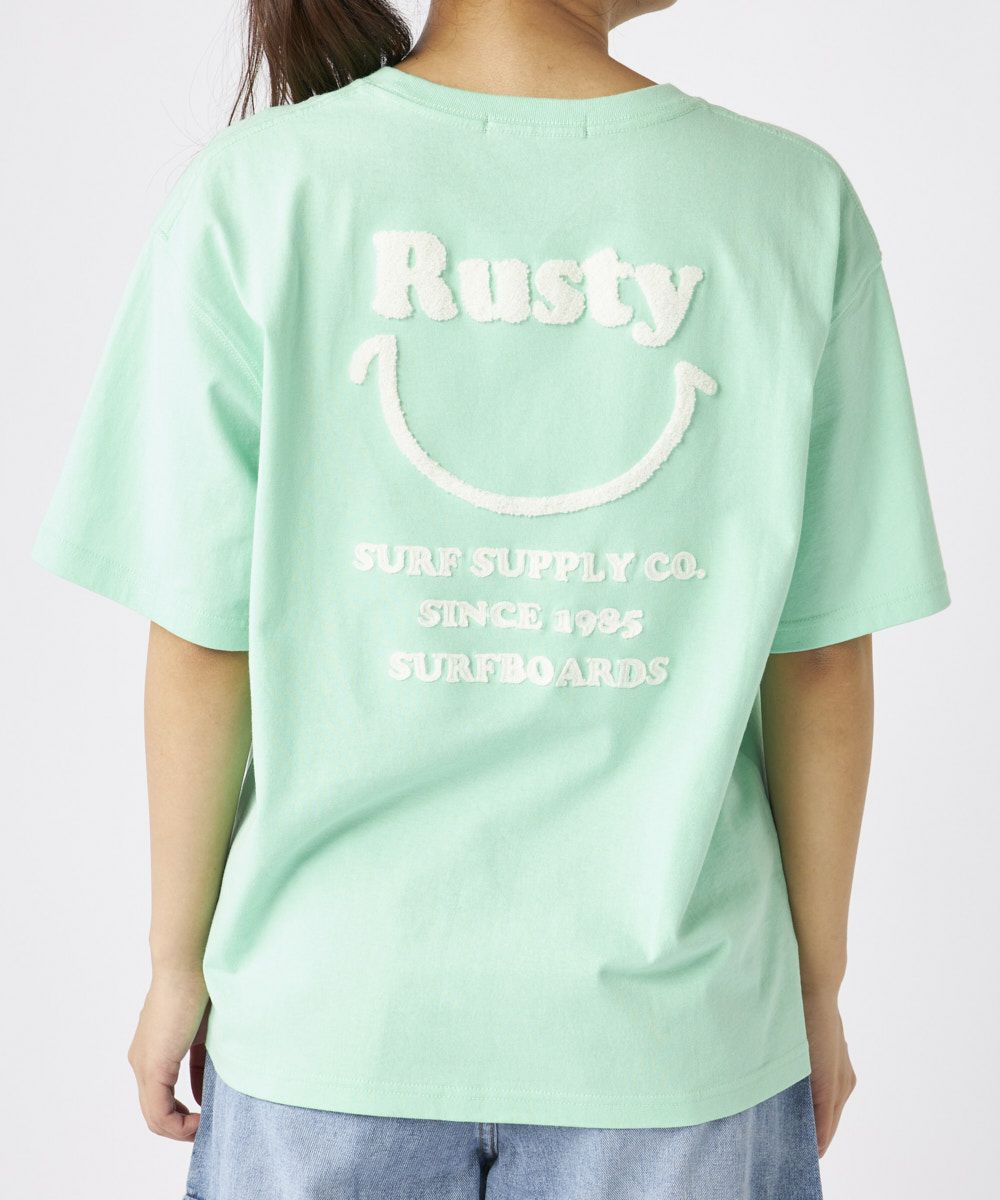 RUSTYレディース ニコちゃん相良刺繍Tシャツ 襟ワンポイント
